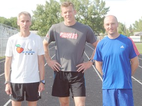 Nine Peace River athletes are training for The Great White North Triathlon in Stony Plain, Alberta on Sunday July 7, 2013. The triathlon covers distances of a two kilometre open water swim, 90 km bike ride and then a 21 km run. Pictured are three of the nine local athletes: Ken Wurst, Bart Jorna and Steven Wedderburn at the Glenmary track in Peace River on Thursday, June 27, 2013.
LOGAN CLOW/PEACE RIVER RECORD-GAZETTE/QMI AGENCY