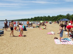 Blind River residents were not going to waste a beautiful sunny Canada Day mowing the lawn. Many spent the day relaxing in the sun at Fourth Sand Beach. Photo supplied
