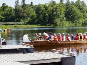 The Algoma Paddlers Canoe and Kayak Club return to the Elliot Lake Boat Launch dock on Sunday afternoon after bringing a group of residents for a canoe ride on Elliot Lake.
Photo by KEVIN McSHEFFREY/THE STANDARD/QMI AGENCY