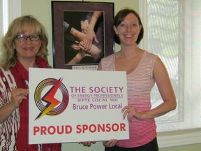 Shirley Heyes (left) of The Society of Energy Professionals presented a cheque to Tiffany Love of Women's House Serving Bruce and Grey for $3,000 on June 17