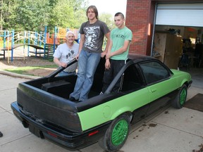 Autobody instructor Dale Portsmouth (left) and students Andrew Wayland (centre) and Reece Basnett pose with the 1992 Pontiac Sunfire the Hines Creek autobody students turned into an El Camino style vehicle, which they have named "El Bird". (Chris Eakin/Fairview Post)