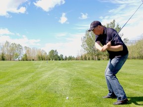 Brent Koebert, a self employed farmer, tees up on hole 2 of 18 during the annual Farmers and Merchants Golf Tournament held on Thursday, June 27. (Daniele Alcinii/Fairview Post)
