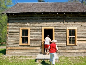 Spectators enter into the newly renovated Revillon Freres building on the Historic Dunvegan grounds. The Revillon Freres building opened to the public on Canada Day. (Daniele Alcinii/Fairview Post)