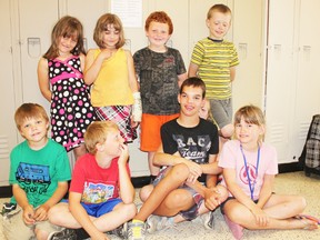 Jaden Wood sits surrounded by friends at the Seaforth Cooperative Children’s Centre during one of his last days at the after school program offered by the daycare.