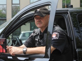 Sgt. Steve Saunders of the Kingston Police holds an electronic metre that can read tint on vehicle windows. Although there is no law in Ontario that prohibits tinting, Saunders says too much tint can pose a safety risk for police, drivers and pedestrians. Tinting is the focus of this month's Selective Traffic Enforcement Program (STEP).
Danielle VandenBrink/The Whig-Standard
