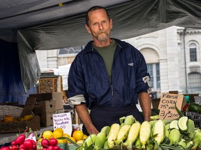 Ryan Totah, who has been growing and selling produce at the Springer Market Square Farmers' Market for 38 years, says that the crops are good but that business has been affected by this summer's rainy weather. 
Sam Koebrich for The Whig-Standard