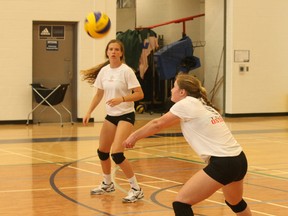 Heather Sigurdson of Toronto (left) and Elena Simpson of London execute a return during practice at the High Performance Centre under 18 provincial team training camp at Nipissing University Wednesday.