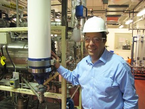 Issac J. Gaon, chief executive office of KmX Corporation, tours the company's pilot plant at the Western Sarnia-Lambton Research Park. (PAUL MORDEN, Observer file photo)