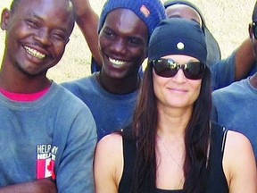 Tammy Babcock stands with members of the First Aid for Peace program in Haiti. She’s the recipient of the 2013 First Capital Honourable Achievement Award.    Supplied photo
