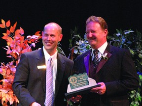 Jerry Hana (right), receiving a chamber of commerce award in 2010, also received a Leaders of Tomorrow award last month. Photo Supplied