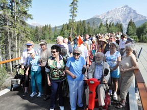 The Banff seniors walking group a.k.a. Banff's dignitaries were the first to walk across the new pedestrian bridge on Tuesday, July 2. CORRIE DIMANNO/CRAG & CANYON/QMI AGENCY