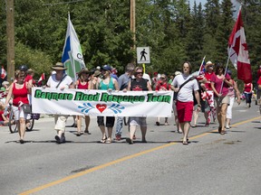 From Town of Canmore employees to fire and recue personnel and heavy equipment operators, Canmore's flood response team received a strong ovation from the town as they made their way downtown during Monday's Canada Day parade. Justin Parsons/ Canmore Leader/ QMI Agency