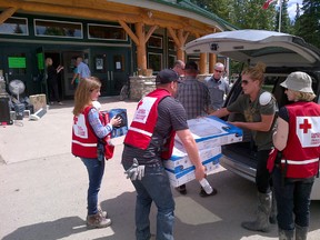 Edmonton-Spruce Grove MP Rona Ambrose (left) assists the Alberta Red Cross with their flood relief efforts in southern Alberta. - Photo Submitted