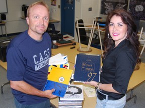 A 50th College Avenue Secondary School reunion is being planned for October 11, 12. Mike Robinson, left, and Margie Matern, reunion committee members hold yearbooks that will be displayed in five decade rooms in the school. The committe is looking for alumni and faculty to drop of school memorabilia at CASS throughout the summer. 
TARA BOWIE / SENTINEL-REVIEW / QMI AGENCY