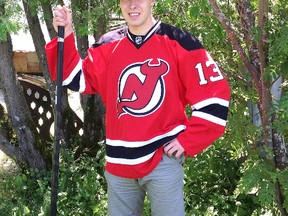 Iroquois Falls native Ryan Kujawinski poses with the New Jersey Devils’ jersey he received after being drafted in the third round (73rd) of the 2013 NHL Entry Draft held this past Sunday at the Prudential Center.