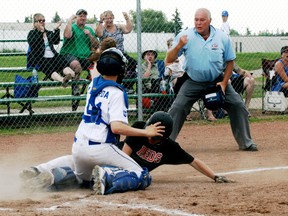 Stony Plain bantam Double A catcher Jaryd Lubdera shows the ball to the umpire after blocking home plate and applying the tag on a Strathmore base runner during provincial playoff seeding action on the weekend. The Royals went on to win this game and remain in Tier 1 action. - Gord Montgomery, Reporter/Examiner