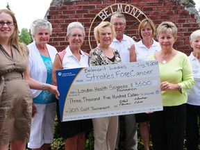 Shannon Digby, left, of London Health Sciences Centre, receives a $3,500 cheque from Barb Abel, of the Belmont Golf Club Ladies' League. The money was raised at the ninth annual Strokes FORE Cancer golf tournament held on June 20. The tournament was a tremendous success, raising the funds to support the Dr. Ann  Chambers  Breast Cancer Research Project at LHSC. Joining in the presentation are other organizing committee members Phyllis Broadhead, back left, Ruby Leverton and Anne Lounsbury, club pro/owner George Loughlean, club manager Sue Todd, and club owner Jan Loughlean. R. MARK BUTTERWICK / St. Thomas Times-Journal / QMI AGENCY