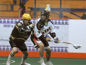 Six Nations Rebels' Kyle Isaacs gets by a Elora Mohawks player Friday, June 28, 2013 at the Iroquois Lacrosse Arena during Ontario Junior B Lacrosse League action. (DARRYL G. SMART Brantford Expositor)