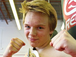 Drake Leduc, 15 of Woodstock poses with his belt he won at the Thai Boxing Association's 2013 Muay Thai Classic Tournament in the boys lightweight junior male class A division - the largest North American Muay Thai event. Leduc, 15, won both his bouts in unanimous decision. MIKE HENSEN/The London Free Press/QMI AGENCY