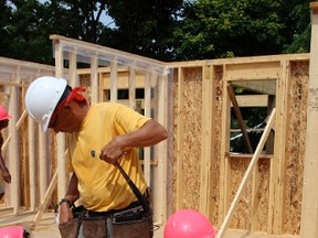 Doug Crease and Angela Vogel assist in the Goderich Habitat for Humanity build.