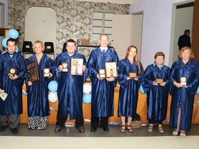 Award winners at the graduation ceremony for the Pembroke Adult High School on Thursday, June 27 show off their new hardware. From left: Andrew Providenti, left, Crystal Mitchell, Joshua Mayne, Christopher Richards, Connie Cheshire, Ivy-Jean Gorgerat and Christine Capranos.