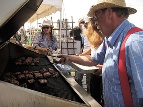 One of 2012’s Leduc #1 rib cook-off entrants works on their racks.