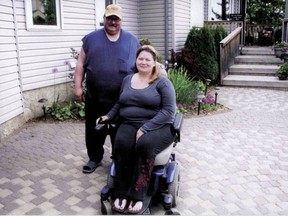 Todd and Debbie Robertson, who recently donated an electric wheelchair to the Devon Lions Club, which will loan it out free of charge to an individual in need.