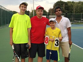 Aiden Poole (left) and Kaanesh Ghosh (right) congratulate Titus Dovancescu and Alex Ghergel (centre) as champions of the Gold Division.