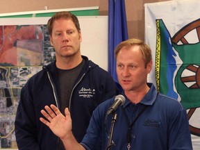 KASSIDY CHRISTENSEN HIGH RIVER TIMES/QMI AGENCY Minister Rick Fraser and Shane Schreiber addressed media Thursday to inform them on the status of more re-entry plans.