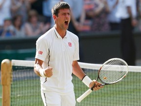 Novak Djokovic celebrates after defeating Juan Martin del Potro in their men's semifinal match at Wimbledon, in London, Friday, July 5, 2013. (Suzanne Plunkett/Reuters)