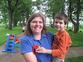 Sarah Hornblower holds her son Josh, 5, at the family's farm on Ridge Road in Lambton Shores. Josh has been diagnosed with autism and Hornblower is concerned his progress will be impacted by wind farms planned for the rural area. Sarnia, Ont., July 5, 2013 (PAUL MORDEN, The Observer)