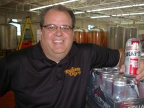 Railway City Brewing Co., St.Thomas, is investing a million-dollars-plus in the future of the award-winning five-year-old craft beer maker, with a move and expansion. Paul Corriveau, vice-president of sales and marketing, holds a can of the brewer's latest railway-themed beer, Canada Southern Draft. (Eric Bunnell, Times-Journal)