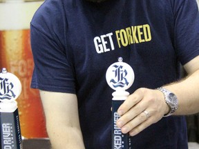 Dave Reed, co-founder of Forked River Brewing out of London, Ont., pours a sample of his Capital Blonde Ale at the Sarnia Beer Show, Friday, July 5, 2013 at the RBC Centre in Sarnia, Ont. (PAUL OWEN, The Observer)
