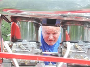 Gary Lonsberry checks out the engine of his 1931 Ford Model A Coupe, Lonsberry has taken many road trips in the car.

GINO DONATO/THE SUDBURY STAR