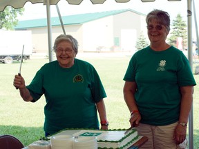 4-H alumni cut the cake during the 4-H alumni celebrations at the Portage Ex, Friday. (ROBIN DUDGEON/PORTAGE DAILY GRAPHIC/QMI AGENCY)