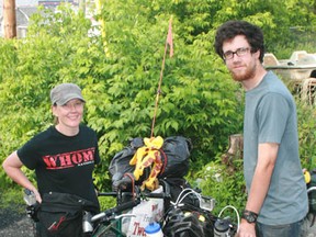 Shannon Hutchison and Caly Fox passed through Kenora, Friday on their way to Victoria, B.C. The cyclists are traveling on tandem bicycles, offering rides to people they meet along the way.

REG CLAYTON/Daily Miner and News