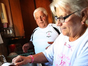 Tony Saini and his sister, Mary Saini, borrowed their mother's kitchen to package up the last of the meatballs Saturday during their annual fundraiser for North Bay's CIBC Run for the Cure taking place Oct. 6. (MARIA CALABRESE The Nugget)