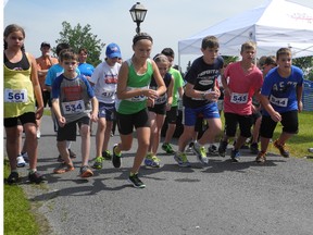 Off like a shot! Brooke Lapierre breaks from the pack quickly in the 10-12 year old division of the Cornwall Multisport Club's kids day races. The group ran 2.5 km around Lamoureux Park. KATHRYN BURNHAM/CORNWALL STANDARD-FREEHOLDER/QMI AGENCY