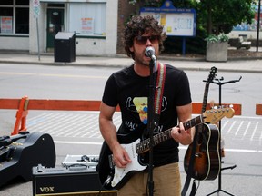 Aaron Ambrose, lead singer and guitarist for St. Thomas band The Affair, plays with his band at the Street Art festival on Saturday. Ben Forrest/QMI Agency/Times-Journal