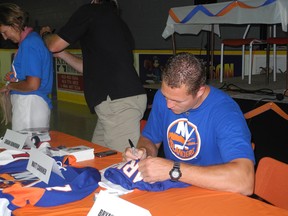 N.Y. Islander Matt Carkner signs autographs at the Carkinator Car Rally July 6, 2013. The event raised $47,000 for the Winchester District Memorial Hospital. KATHRYN BURNHAM/CORNWALL STANDARD-FREEHOLDER/QMI AGENCY