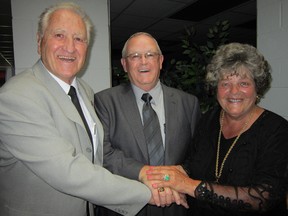 Junior hockey executive Mike Bollert of Simcoe, centre, and former umpire Rita Kalmbach of Port Dover – the inaugural mayor of Norfolk County – were inducted into the Norfolk County Sports Hall of Recognition on Saturday. At left is Chuck Brimmer of Simcoe, past chair of the sports hall committee. A total of eight local athletes in all were inducted during this weekend’s ceremony. (MONTE SONNENBERG Simcoe Reformer)