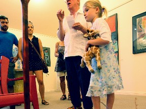 David Carlin and his granddaughter, Jamie, during the opening Saturday of his latest exhibit Intransit featuring contemporary paintings, sculptures experimental videos produced in Havana, Cuba and North Bay, on display at the Alex Dufresne Gallery in Callander. (MARIA CALABRESE The Nugget)