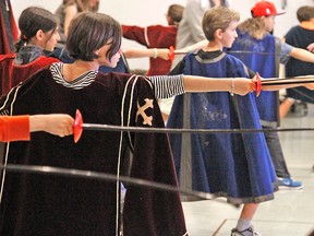 Some young Musketeers learn the finer points of swordplay during a workshop at the Festival Theatre Sunday. MIKE BEITZ / The Beacon Herald