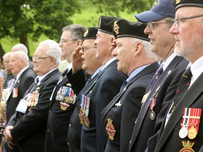 Ojibwa submariners share in a spirited rendition of O Canada during the sub’s official opening Saturday at Port Burwell. Jeff Tribe/Tillsonburg News