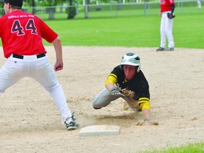 Portage's Robert Smith slides back into first during a South Central League semifinal game against Winkler July 7. (Kevin Hirschfield/The Graphic/QMI AGENCY)