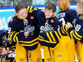 The Toronto Bulldogs celebrate their third straight Brick Invitational Super Novice Hockey Tournament championship at the Ice Palace in West Edmonton Mall on Sunday, July 7, 2013. The Bulldogs won the title after downing the B.C. Junior Canucks 3-1. TREVOR ROBB QMI AGENCY