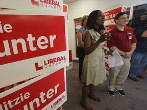 Ontario Liberal candidate Mitzie Hunter, left, is joined by Liberal MP Brad Duguid over the weekend at her office in the riding of Scarborough-Guildwood. (JACK BOLAND/Toronto Sun)