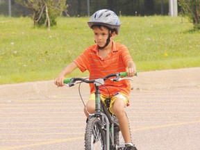 Sam Mohammed of Petawawa closes in on the finish line during the bike leg of the 2013 Petawawa Kids of Steel Triathlon, held Sunday at Dundonald Hall. A total of 80 took part in the sporting event. For more community photos, please visit our website photo gallery at www.thedailyobserver.ca.