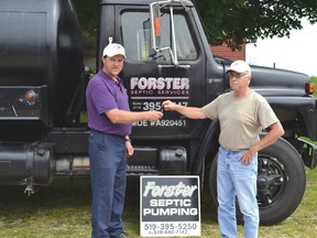 Justin Murray takes the keys to the truck from his uncle Ross Forster as he takes the Forster Septic Services business over from him. Forster ran the business for 27 years and before that Ross' father did for 26 years. Murray officially took the business over on July 1.