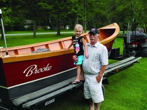 Carol Laplante and his great-granddaughter Brooke stands by his handmade boat, which has been 45 years in the making.        Wayne Lowrie - Gananoque Reporter